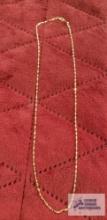 Gold colored link chain, marked 10K