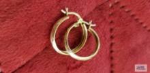 Gold colored hoop earrings, marked 10K, approximate total weight is 1.21 G