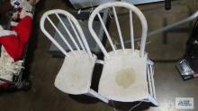 Two painted white wooden chairs