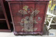 Three drawer floral cabinet