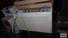 General Electric window air conditioner with accessories and remote. in basement