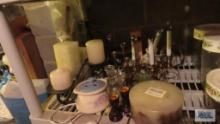 lot of candle holders and candles