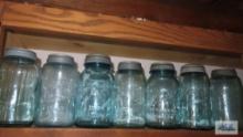 Shelf lot of vintage canning jars with zinc lids