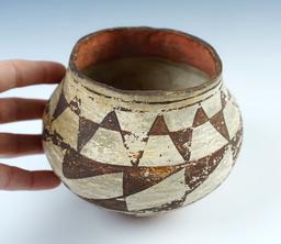 5" wide x 4 1/2" tall Acoma Polychrome Jar with a dimpled base. Ex Russell E. Morris. COA.