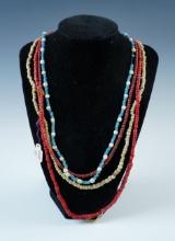 Set of 4 Strands of assorted Trade Beads. The largest is 26".