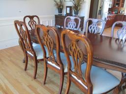 Beautifully Carved Mahogany Finish Dining Table, Armchairs, Side Chairs and Leaves