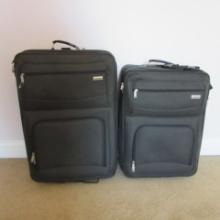 Two Black Soft Side Protocol Rolling Suitcases