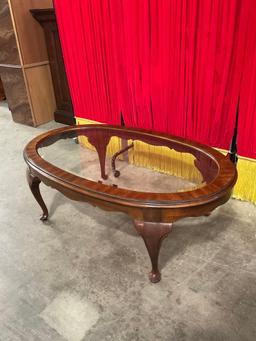 Vintage Oval Glass Topped Wooden Coffee Table w/ Cabriolet Legs. Measures 45" x 16". See pics.
