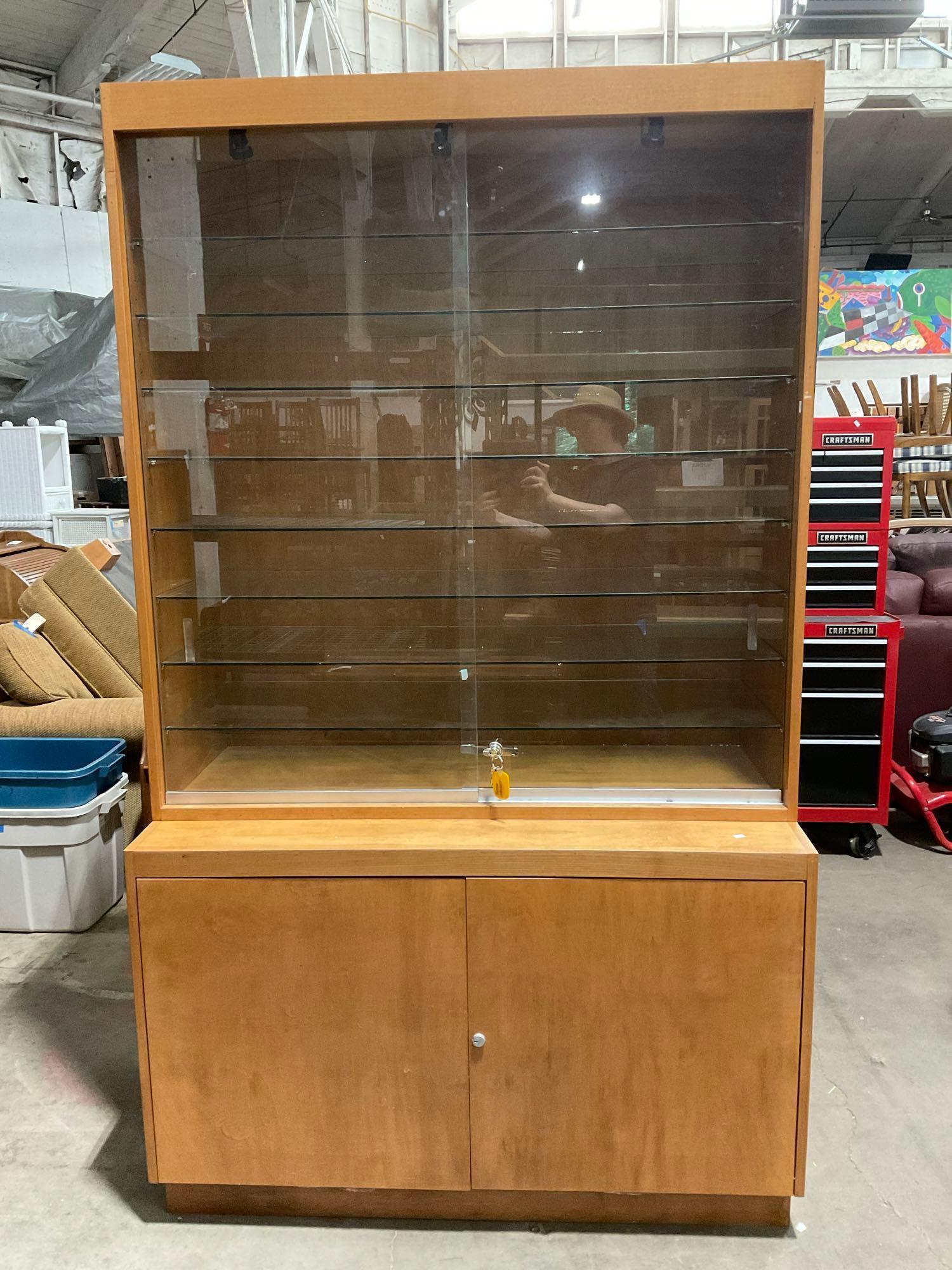 Vintage 2 Piece Locking Glass Fronted Illuminated Display Case w/ 8 Glass Shelves & Cupboard. See