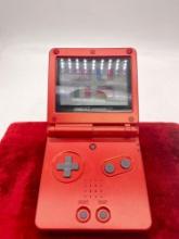 Nintendo GameBoy Advance SP red handheld console with Need for Speed Underground 2
