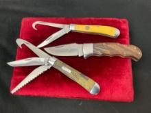 Trio of Elk Ridge Folding Pocket Knives, Single Blade, Double Blade w/ Guthook, Triple Blade w/ Saw