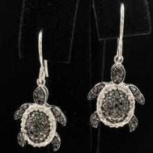 Pair of estate sterling silver diamond earrings