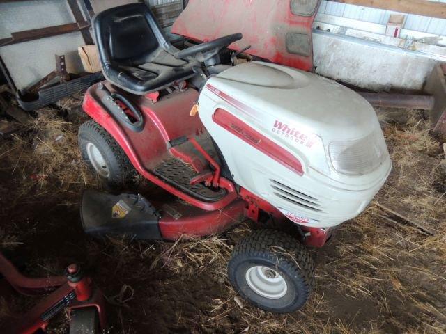 White outdoor riding lawn mower tractor, condition unknown, for parts Toro