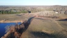 16.96 +/- Acres of wooded and open land with pond views