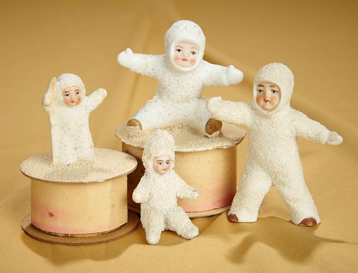 Lot of four German bisque Snowbabies and Candy Containers. $300/400