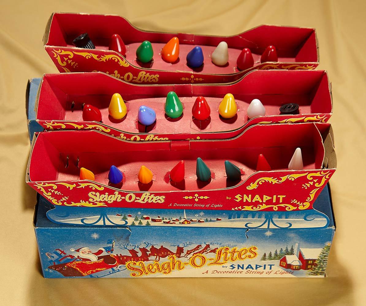 Three "Sleigh-O-Lites" Christmas light sets by Snapit in original sleigh boxes. $100/300