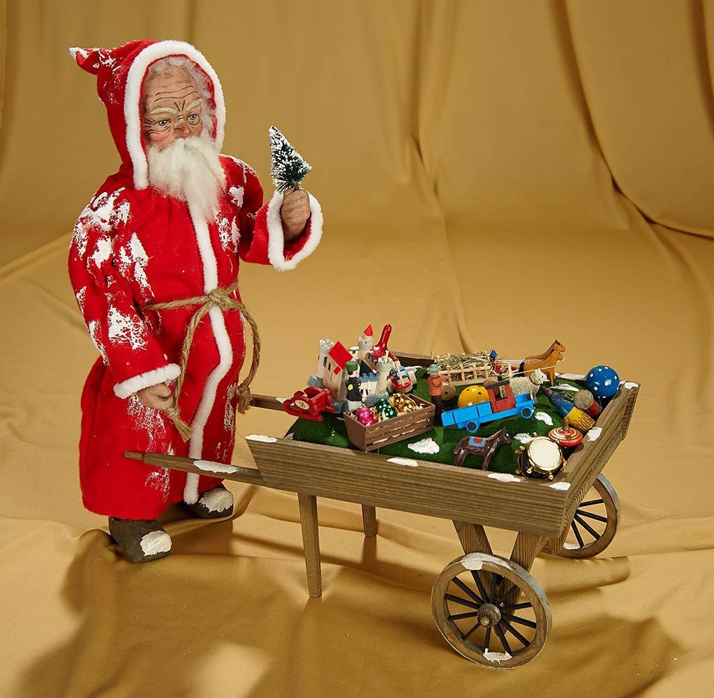 14" 19th century style St. Nicholas and toy cart by Werner Brauer. $400/600