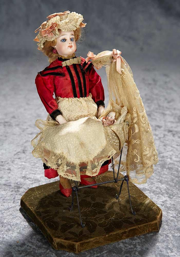 12" Charming French mechanical "Nanny Rocking the Cradle" in original presentation. $1800/2500