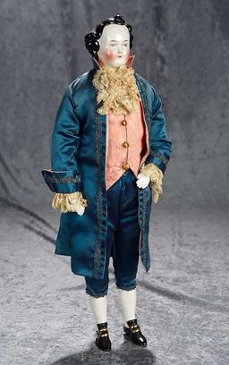 20" German porcelain gentleman doll in fine silk costume in the 18th century style. $400/500