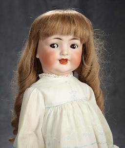 19" German bisque flirty eyed character toddler, 126, by Kammer and Reinhardt. $300/500