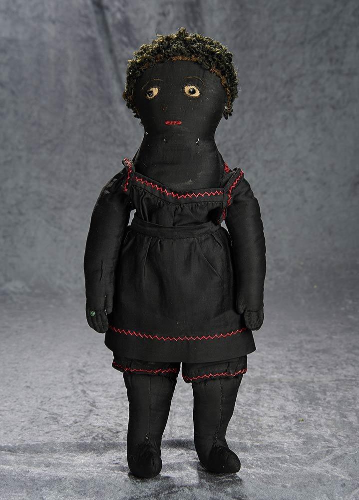 20" American black sateen folk doll with original costume. $400/600