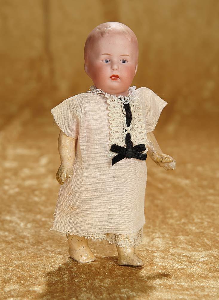 7 1/2" German bisque character with pouting expression by Gebruder Heubach. $400/500
