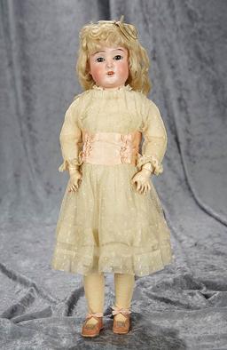 16" German bisque child, 1906, by Schoneau and Hoffmeister, original wig and costume. $400/500