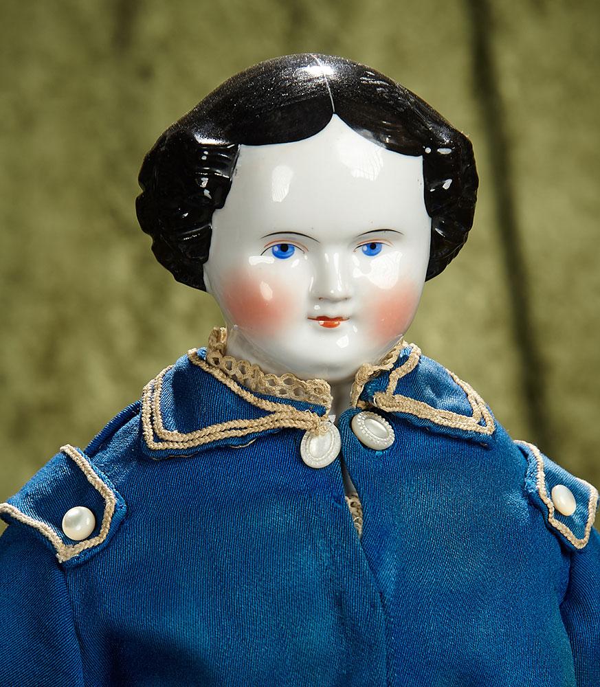 22" German porcelain doll with fine antique costume. $400/500