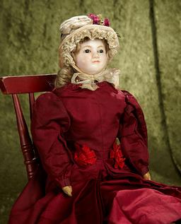 24" English wax doll with endearing expression, lovely antique costume and bonnet. $500/700