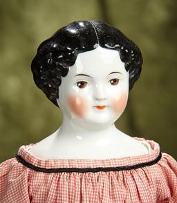 17" German porcelain doll with rare brown painted eyes. $400/500