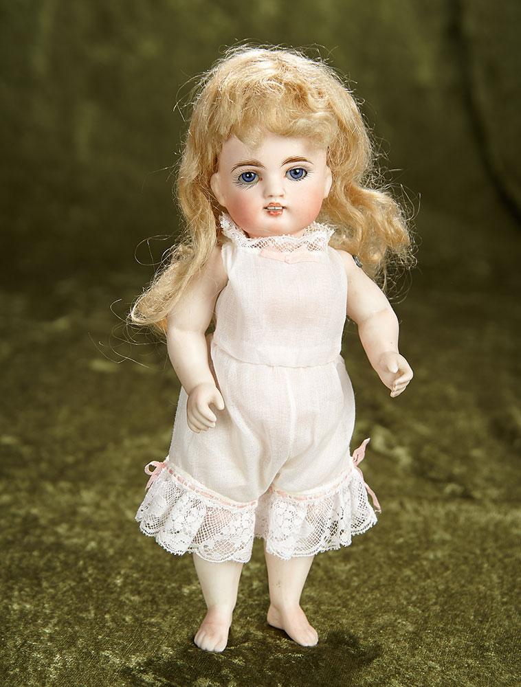 9" Rare German All-Bisque Miniature Doll with Bare Feet. $800/1000