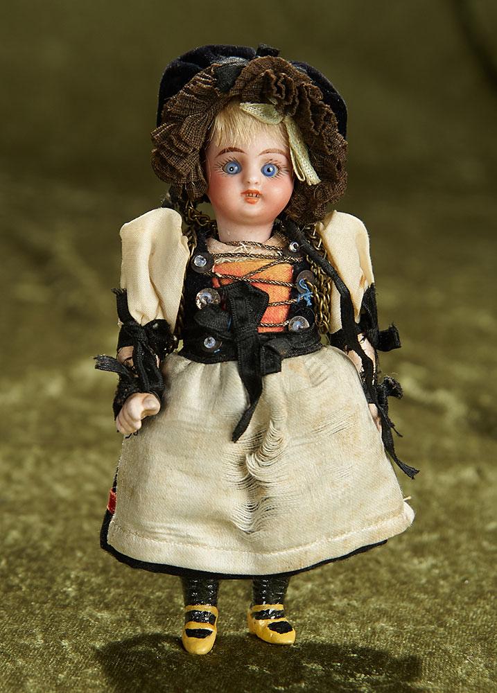 6" German bisque miniature doll in original folklore costume. $200/300