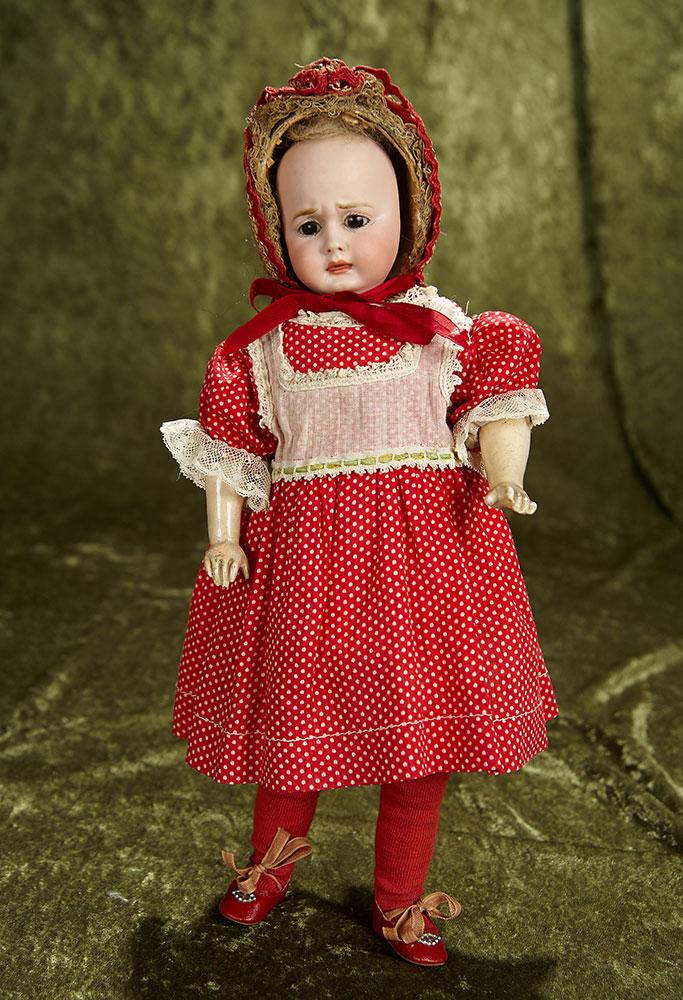 12" German bisque two-faced doll by Carl Bergner with Simon and Halbig faces. $900/1100
