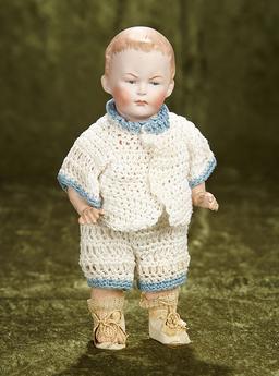 8" German bisque toddler, 9591, by Gebruder Heubach with scowling expression. $400/500