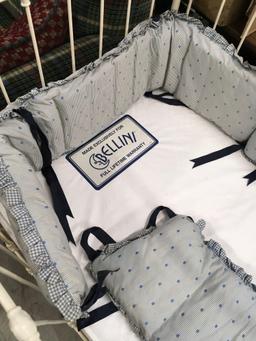 Vintage baby crib with bedding