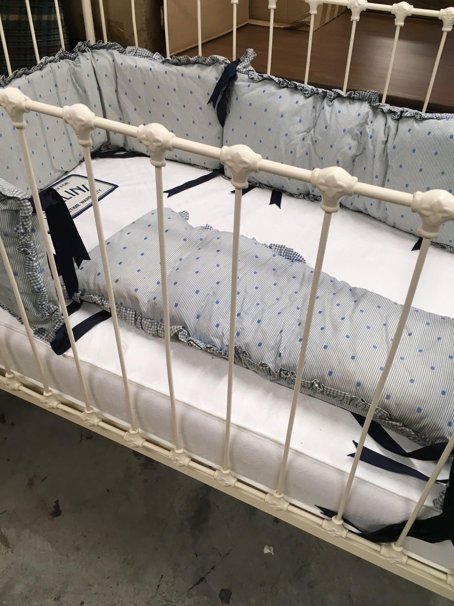 Vintage baby crib with bedding