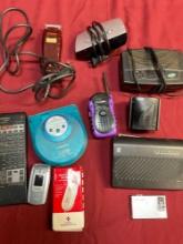 AM/FM radios, transmitter, remote, cell, etc. 11 pieces electronics with cords turned on. 11 pieces