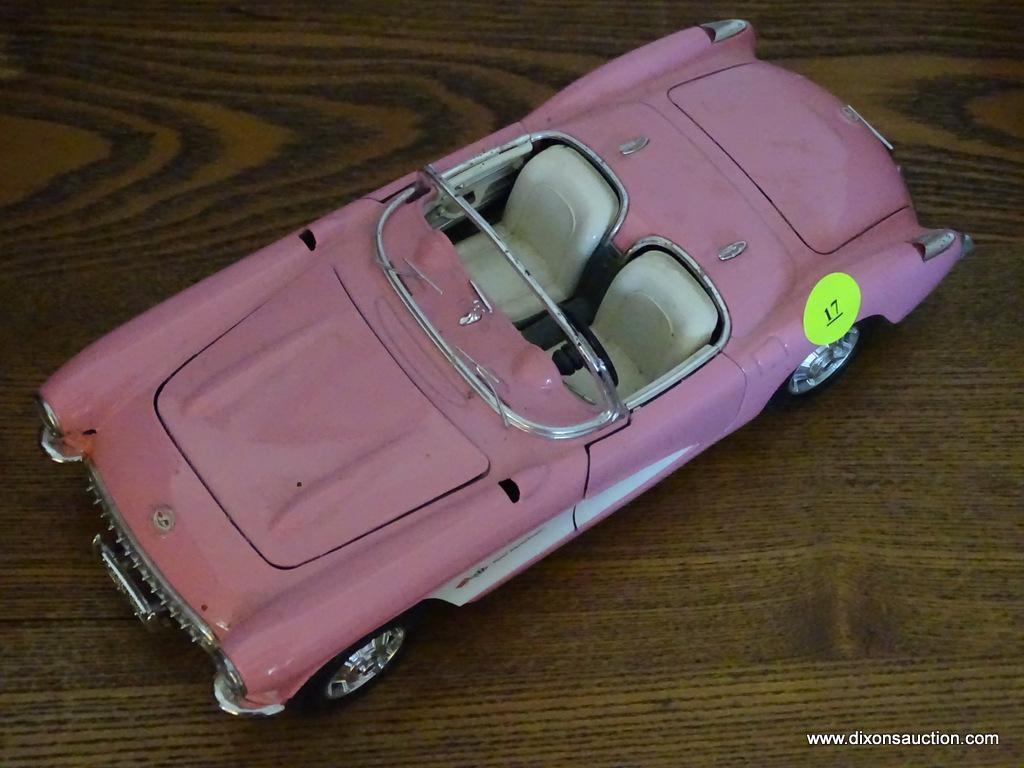 (LR) CHEVROLET CORVETTE MODEL CAR; BURAGO 1957 PINK CHEVROLET CORVETTE 1/18 SCALE MODEL CAR.