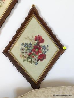 (LR) LOT OF NEEDLEPOINT FRAMED PICTURES; 2 DIAMOND SHAPED FLOWER NEEDLE POINTS SITTING IN A WOODEN