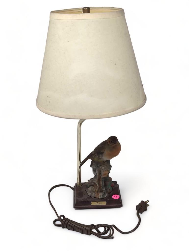 (FOYER) CERAMIC PUCCI BIRD TABLE LAMP WITH WOOD BASE, BRASS ARM, BRASS HARP, FINIAL, & PAPER SHADE.