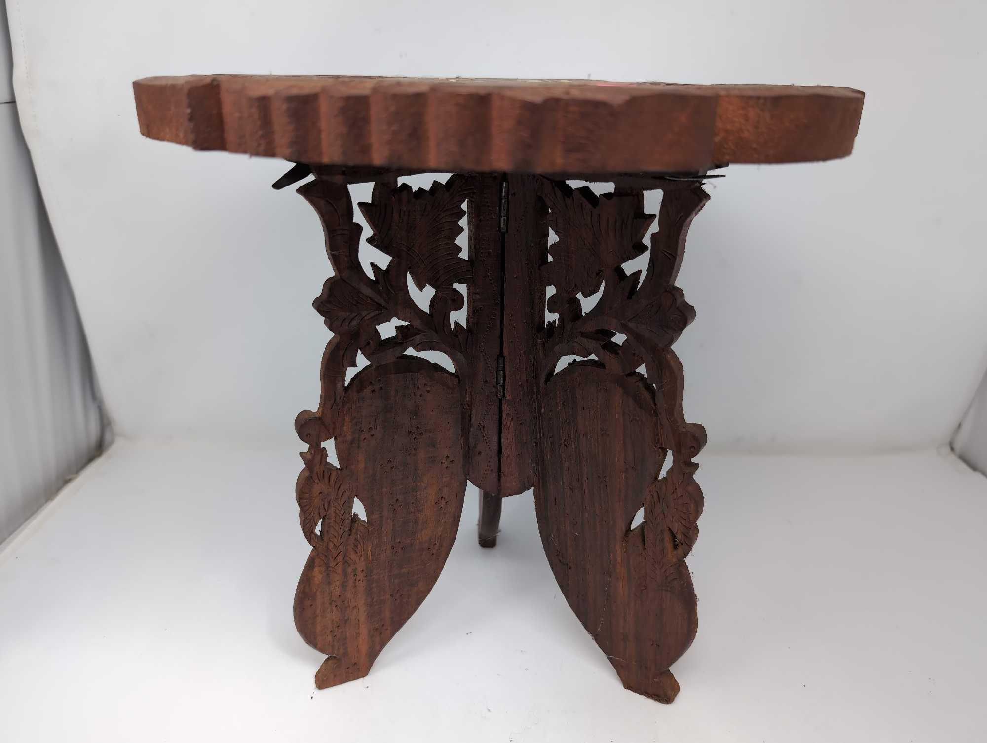 (LR) ANTIQUE HAND CARVED INDIAN PLANT STAND TABLE DEPICTING A FISH DETAILED TOP, INLAID WITH BOVINE.