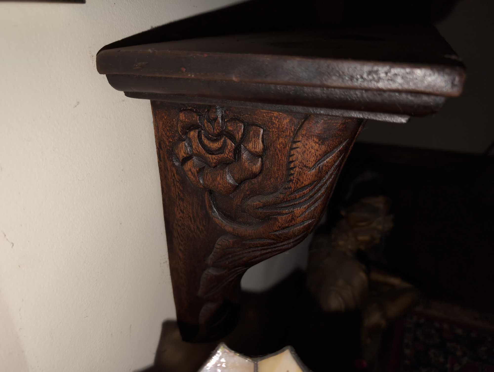 (FOYER) ANTIQUE HIGHLY CARVED WOOD WALL HANGING SHELF WITH FLORAL AND LINE DETAILING. IT MEASURES