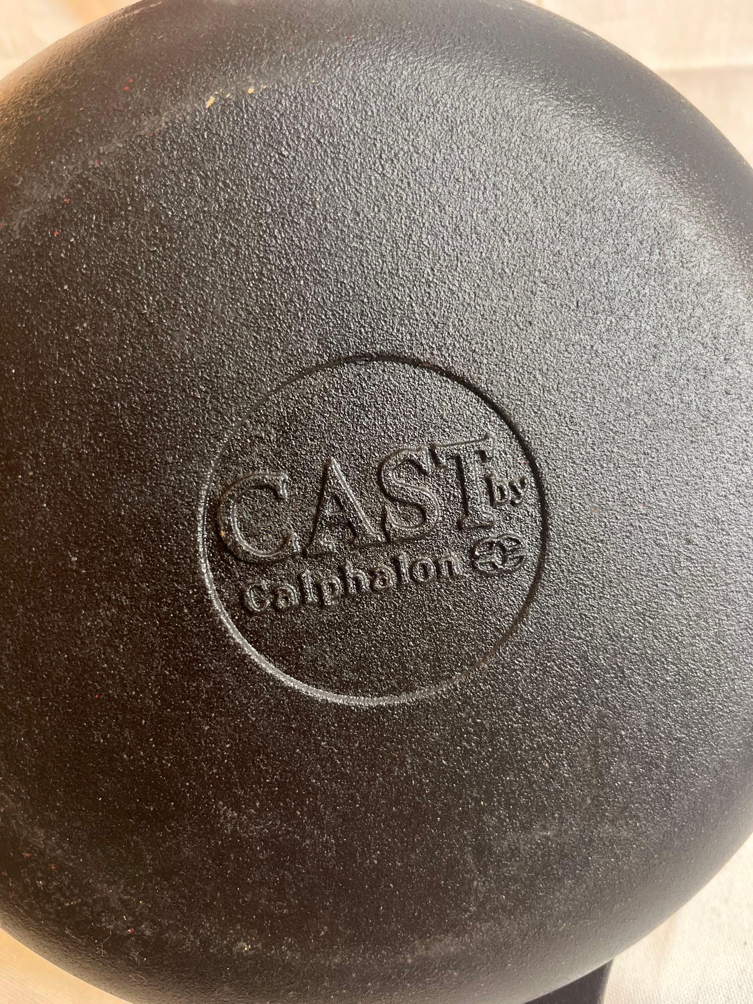 Two cast iron pans. Cast by Calphalon. 11".