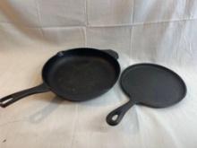 Two cast iron pans. Cast by Calphalon. 11".