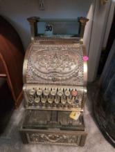(BR2) ANTIQUE HEAVILY DETAILED BRASS PLATED CASH REGISTER IN WORKING CONDITION. IT MEASURES 9-1/2"W