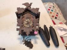 (BR2) VINTAGE BLACK FOREST WOOD CUCKOO CLOCK WITH WEIGHTS. NO PENDULUM.