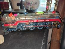 (LR)BATTERY OPERATED TIN TOY, SILVER MOUNTAIN LOCOMOTIVE WITH OPERATOR, UNTESTED, IN GOOD CONDITION.