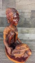 ETHNIC CHARACTER WITH FISH WOOD STATUE