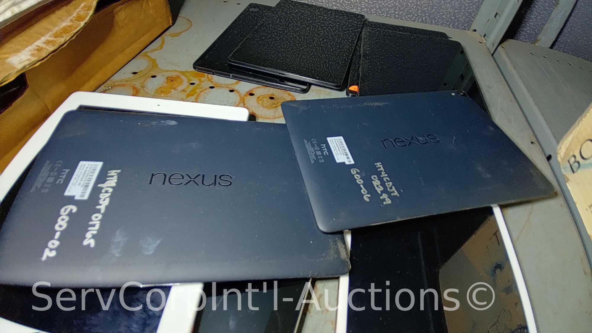 Lot on 2 Shelves Various i-Pad's & Nexus Tablets (may be locked and/or have cracked screens), Signed