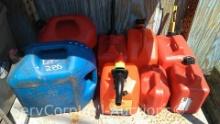 Lot on Shelf of Various Plastic Gas Cans